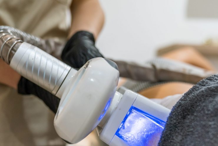 The Patient undergoing Cryolipolysis treatment, which is a technique that reduces fat through controlled intense cooling of the area to be treated